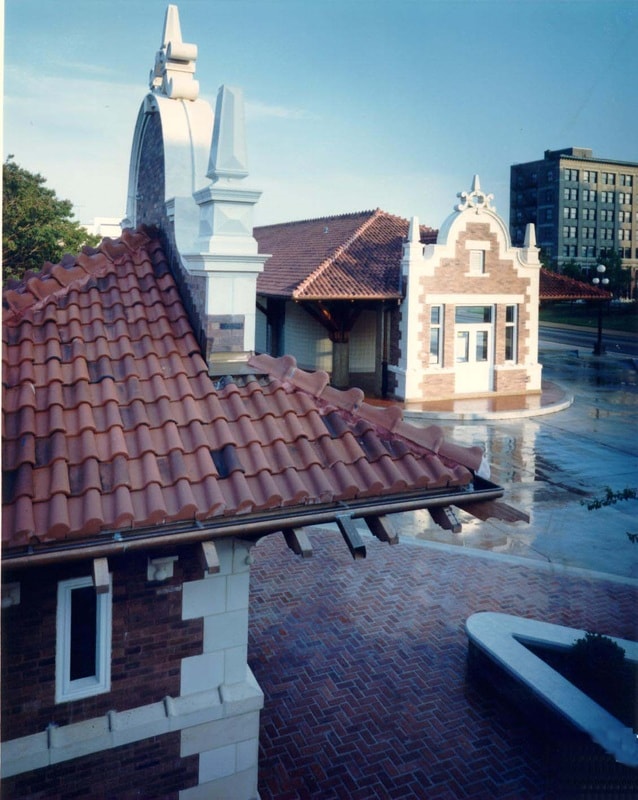 Historic plaza rooftop with red clay tile and ornate white masonry details